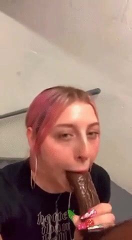 Holly sucking on a big black bull